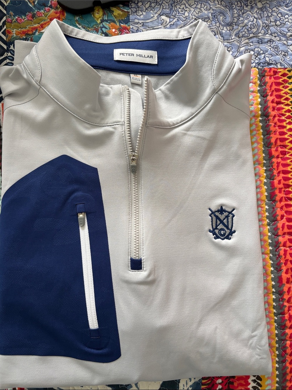Peter Millar Verge Performance l quarter-zip pullover in a gray and blue